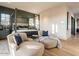 Bedroom features a luxurious four-poster bed and cozy lounge chairs, with great natural light at 3955 E Sierra Vista Dr, Paradise Valley, AZ 85253