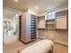 Spacious walk-in closet with custom shelving and bench seating at 3955 E Sierra Vista Dr, Paradise Valley, AZ 85253