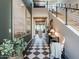 Inviting entryway featuring a black and white tiled floor and a staircase at 3955 E Sierra Vista Dr, Paradise Valley, AZ 85253