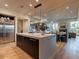 Modern gourmet kitchen features stainless steel appliances, a center island, custom cabinets, and views to the living spaces at 3955 E Sierra Vista Dr, Paradise Valley, AZ 85253
