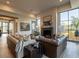 Cozy living room featuring a fireplace, large windows, and plush seating at 3955 E Sierra Vista Dr, Paradise Valley, AZ 85253