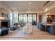 Bright and airy living room with a fireplace, hardwood floors, and large windows at 3955 E Sierra Vista Dr, Paradise Valley, AZ 85253