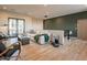 Open-concept living room with a sofa, chairs, wood floors, and a balcony with great natural light at 3955 E Sierra Vista Dr, Paradise Valley, AZ 85253