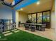 Entertainer's backyard with a stainless steel grill, outdoor dining, and seamless indoor-outdoor living at 3955 E Sierra Vista Dr, Paradise Valley, AZ 85253
