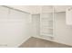 Large walk-in closet with shelving and hanging rods at 25218 N 160Th Dr, Surprise, AZ 85387