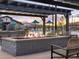 Relaxing fire pit area with comfortable seating under a pergola at 25218 N 160Th Dr, Surprise, AZ 85387