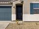 Modern front door with dark color and sidelights at 25218 N 160Th Dr, Surprise, AZ 85387