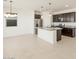 Modern kitchen featuring dark cabinetry and a large island at 25218 N 160Th Dr, Surprise, AZ 85387