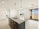 Modern kitchen island with granite countertop and double sink at 25218 N 160Th Dr, Surprise, AZ 85387