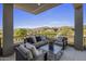 Inviting outdoor living space with comfortable seating and stunning views of the surrounding landscape at 37200 N Cave Creek Rd # 2110, Scottsdale, AZ 85262