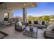 Expansive balcony showcasing comfortable seating and views of the surrounding landscape and golf course at 37200 N Cave Creek Rd # 2110, Scottsdale, AZ 85262