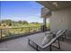 Relaxing outdoor lounge area with chaise lounges overlooking a lush golf course at 37200 N Cave Creek Rd # 2110, Scottsdale, AZ 85262