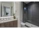 Modern bathroom featuring double vanity, a shower with glass door, and contemporary fixtures at 37200 N Cave Creek Rd # 2110, Scottsdale, AZ 85262