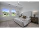 Bright bedroom with large windows overlooking golf course views, featuring a neutral color scheme at 37200 N Cave Creek Rd # 2110, Scottsdale, AZ 85262