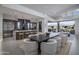 Open dining area features a modern table with plush chairs and a large island with seating at 37200 N Cave Creek Rd # 2110, Scottsdale, AZ 85262