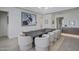Elegant dining room featuring a long, dark wood table and plush white chairs under bright lighting at 37200 N Cave Creek Rd # 2110, Scottsdale, AZ 85262