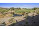 Scenic golf course view featuring lush greenery, a pond, and a stone bridge at 37200 N Cave Creek Rd # 2110, Scottsdale, AZ 85262