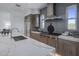 Gourmet kitchen with stainless steel appliances, gray backsplash, and a marble waterfall island at 37200 N Cave Creek Rd # 2110, Scottsdale, AZ 85262
