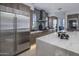 Updated kitchen with stainless appliances, marble counter tops, custom cabinetry and central island at 37200 N Cave Creek Rd # 2110, Scottsdale, AZ 85262