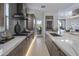 Kitchen with stainless steel appliances, marble countertops, and a breakfast bar with seating at 37200 N Cave Creek Rd # 2110, Scottsdale, AZ 85262
