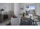 Stylish home office with a wet bar, desk area, and patio access offering a unique workspace at 37200 N Cave Creek Rd # 2110, Scottsdale, AZ 85262