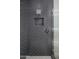 Modern gray tiled shower includes a rainfall showerhead and a convenient built-in niche at 37200 N Cave Creek Rd # 2110, Scottsdale, AZ 85262