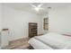 Bedroom with ceiling fan and wood-look tile flooring at 3932 N Silver King Ln, Casa Grande, AZ 85122