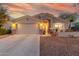 One-story home with a two-car garage and landscaped front yard at 3932 N Silver King Ln, Casa Grande, AZ 85122