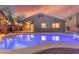 Luminous pool at dusk with pergola and home visible in the background at 3932 N Silver King Ln, Casa Grande, AZ 85122