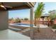 Inviting kidney-shaped pool with a covered patio area at 3932 N Silver King Ln, Casa Grande, AZ 85122