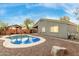 Stunning pool and patio area adjacent to the home with desert landscaping at 3932 N Silver King Ln, Casa Grande, AZ 85122