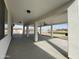 Covered patio with concrete flooring, ceiling fan, and views of the pool at 12827 S Hermit Rd, Buckeye, AZ 85326