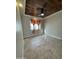 Cozy bedroom with tile floors and wood-paneled ceiling at 12827 S Hermit Rd, Buckeye, AZ 85326