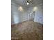 Bright bedroom with tile flooring, mirrored closet doors, and ceiling fan at 12827 S Hermit Rd, Buckeye, AZ 85326