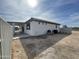 Exterior view of house showcasing backyard and partial fence at 12827 S Hermit Rd, Buckeye, AZ 85326