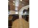 Spacious kitchen with dark wood cabinets and granite counters at 12827 S Hermit Rd, Buckeye, AZ 85326