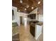 Kitchen with dark wood cabinets, granite counters, and wood ceiling at 12827 S Hermit Rd, Buckeye, AZ 85326