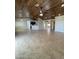 Open living room with high ceilings, tile floors, and a ceiling fan at 12827 S Hermit Rd, Buckeye, AZ 85326