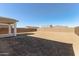 Empty lot with new home in background at 5018 W Top Hand Trl, Laveen, AZ 85339