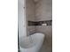 Bathroom featuring a modern white soaking tub and tiled walls and recessed shelves at 12232 N 65Th Pl, Scottsdale, AZ 85254