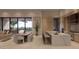 A modern kitchen with a large marble island, stainless steel appliances, and an adjacent dining area with scenic views at 12232 N 65Th Pl, Scottsdale, AZ 85254