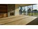 Bright living room with stone fireplace and large windows overlooking the yard at 12232 N 65Th Pl, Scottsdale, AZ 85254