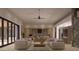Expansive living room featuring modern furnishings, recessed lighting, and an open layout with easy access to the kitchen at 12232 N 65Th Pl, Scottsdale, AZ 85254