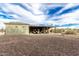 View of the backyard showcasing a large, open space and a covered patio area at 38334 N 20Th St, Phoenix, AZ 85086