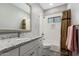 Bathroom showcasing a sleek, tiled shower and granite countertop at 38334 N 20Th St, Phoenix, AZ 85086