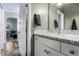 Well-lit bathroom features a granite countertop and white cabinetry at 38334 N 20Th St, Phoenix, AZ 85086