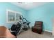 Bedroom featuring exercise equipment and comfortable chair at 38334 N 20Th St, Phoenix, AZ 85086