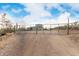 Exterior view of the property's gated entrance, leading to the main house and ample parking space at 38334 N 20Th St, Phoenix, AZ 85086