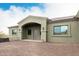 Exterior front view of home with covered entry, beautiful stonework, and landscaped front yard at 38334 N 20Th St, Phoenix, AZ 85086