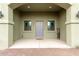 Exterior front view of home's covered entry, showcasing desert landscape and welcoming entrance at 38334 N 20Th St, Phoenix, AZ 85086